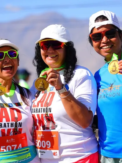 The pure joy of achievement. Three members of our team proudly show off their finisher medals after conquering the Ladakh Marathon, smiles all around. This is the moment all the hard work pays for.