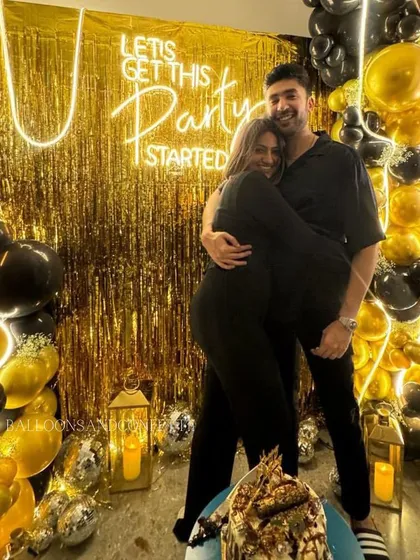 It was a pleasure creating this decor for a client's celebration. The happy couple looks perfect against the black and gold backdrop we designed.