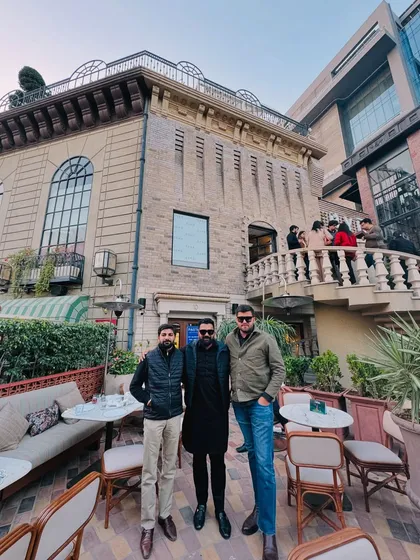 With friends outside a classic European-style building. As the saying goes, a lawyer's time and advice are his most valuable assets.