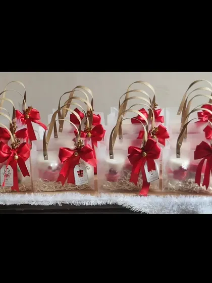 My New Year gift sets packed and ready to go in clear acrylic bags with festive red bows.