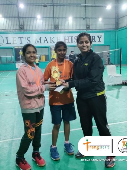 A young girls' doubles team receiving their trophy. I strongly encourage female participation in all my tournaments.