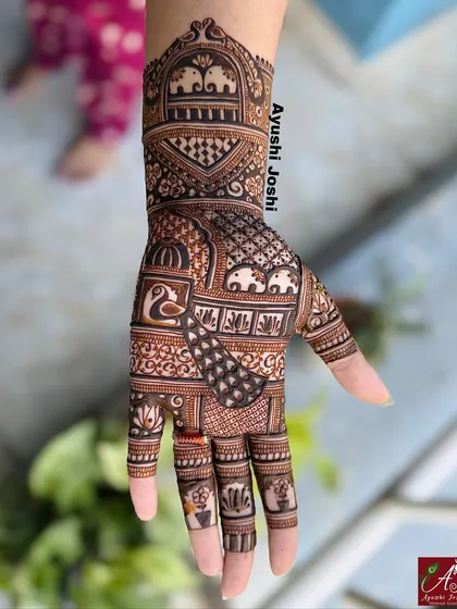A beautiful Karva Chauth design featuring royal motifs like elephants and peacocks, perfect for celebrating the festive spirit.