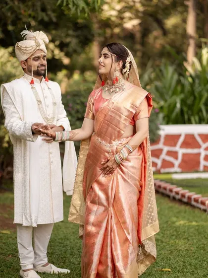 My bride Abha looked absolutely radiant for her Pheras. Her peachy-pink saree and mint green jewelry were so fresh and unique. I created a minimal glam look with a natural, glowy base to enhance her beauty without overpowering her style.