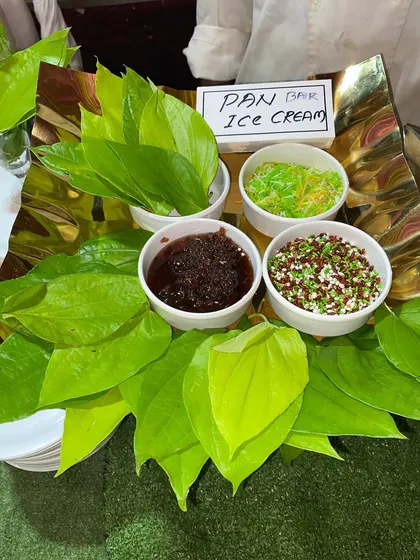 The complete setup for our Paan Ice Cream station, with fresh paan leaves and various sweet fillings.
