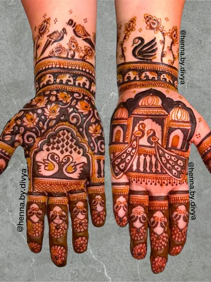 This design has a distinctly royal feel, with peacocks in jharokhas (windows), swans, and birds. The use of negative space makes the intricate figures stand out.