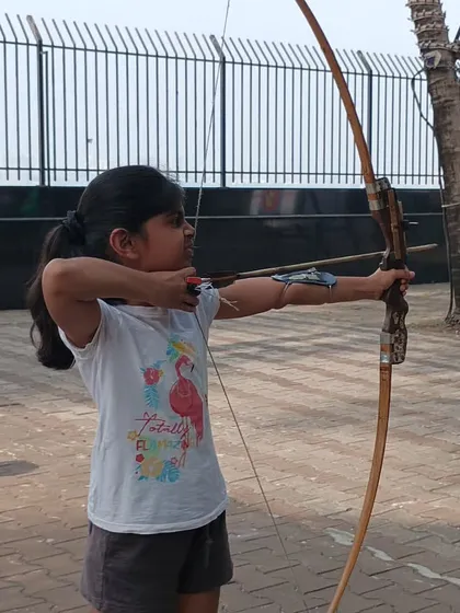 Even our youngest students learn to shoot with impressive form and concentration.