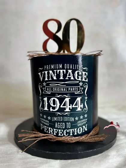 Aged to perfection! A minimalist and classy 80th birthday cake with a vintage label design, perfect for a gentleman.