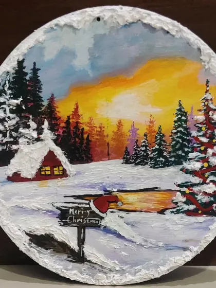 Capturing the magic of a white Christmas on a slice of wood. This piece, with its snowy cabin and decorated tree, shows the beautiful, detailed artwork we create during my festive Christmas workshops.
