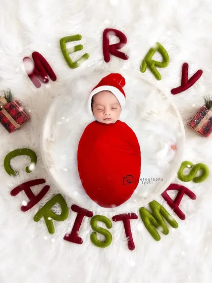 Celebrating a baby's first Christmas with a cozy and festive newborn shoot. I use safe posing techniques and soft props to keep your little one comfortable while creating beautiful holiday-themed portraits.
