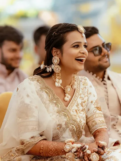 A candid moment of laughter, showing how the makeup stays perfect even during the most joyous moments.