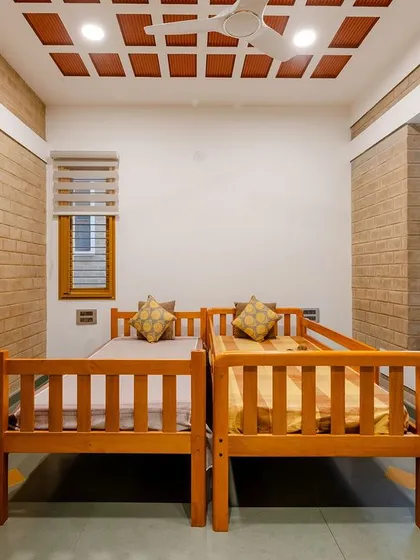 A closer look at the twin beds and the natural materials used in the bedroom.