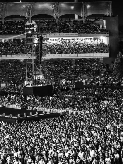A wide shot capturing the sheer density and scale of the audience at The Wonderment Tour. We handle logistics for tens of thousands of attendees, ensuring a safe and seamless experience for every fan.