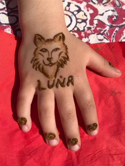 Another version of the wolf design for Luna, with cute henna dots on her fingertips.