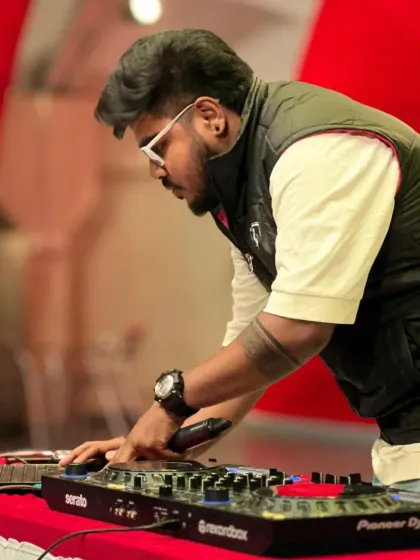 Focused on the mix during a live set at Christ University. This is where I craft the journey of the night, blending tracks and reading the crowd to keep the energy peaking on my Pioneer DJ setup.