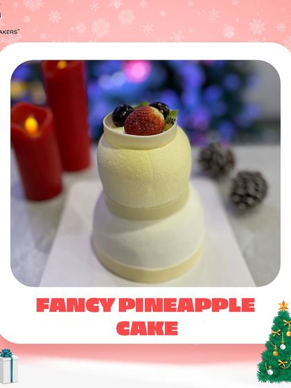 A festive twist on a classic. Our fancy pineapple cake is presented in a tiered shape and topped with fresh fruit, making it a light and elegant addition to your Christmas dessert table.