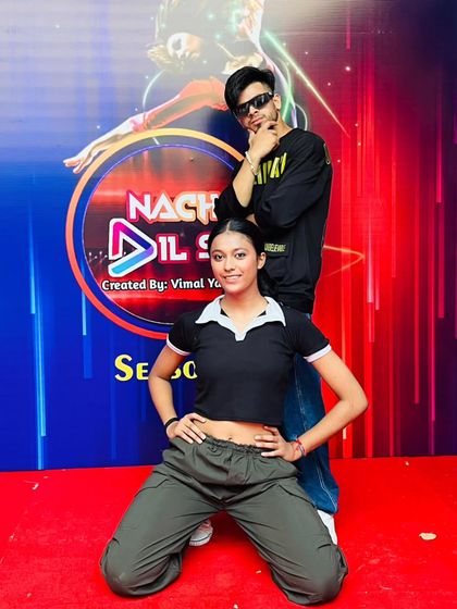 My student and I in front of the Nacho Dil Se branding. We guide our students on how to present themselves professionally.