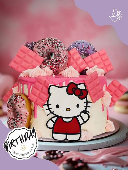 A purr-fectly cute Hello Kitty cake, overloaded with donuts and pink chocolate bars. This fun and trendy design is a sweet treat for any fan of the iconic character.