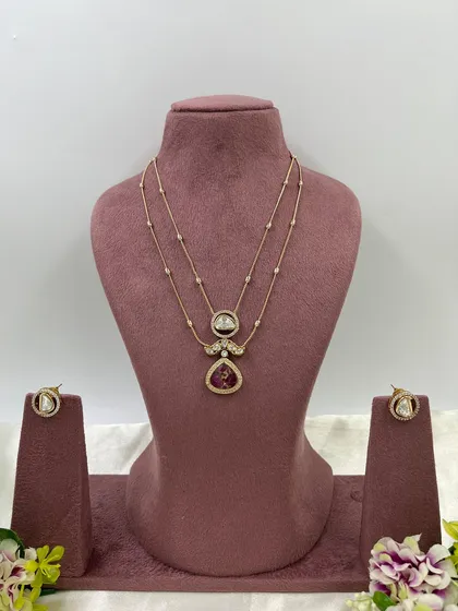 The 'Myra' necklace with a red pendant.
