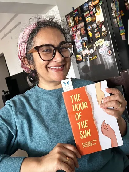 It's pure joy seeing the faces of our published poets. Here, Monisha Thomas smiles with her copy of 'The Hour of the Sun', a book that now holds a piece of her soul.