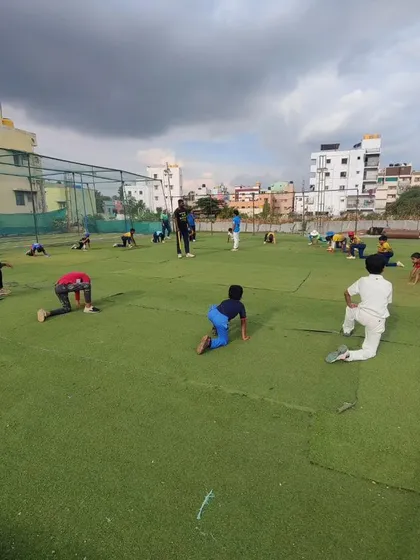 A group of players doing stretching exercises. Flexibility is just as important as strength in cricket.