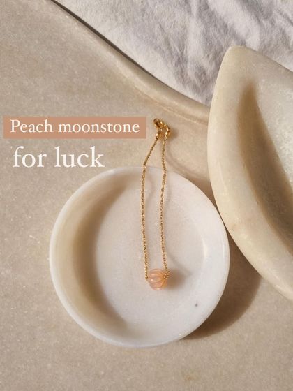 This is my Peach Moonstone melon charm, a stone for luck and new beginnings.