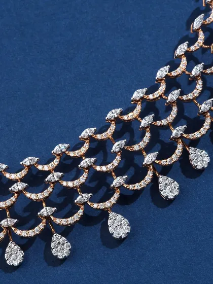 A macro detail shot of the Ranka Jewellers diamond necklace. This view shows the beautiful, scalloped pattern and the quality of the diamond setting.