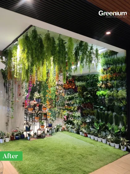This indoor green corner is a statement that nature belongs everywhere. We used a combination of vertical walls, hanging plants, and artificial grass to create a soothing, immersive environment.