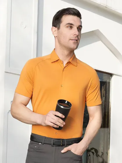 A medium shot of a model in an apricot shirt, looking off-camera in a bright, outdoor setting. This type of image provides a clear view of the product in a natural, relatable context for customers.