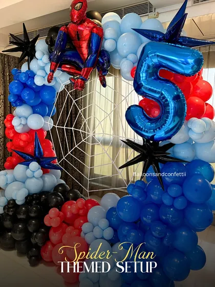 I love bringing a child's favorite hero to life. This Spider-Man themed 5th birthday party features a dynamic balloon arch in classic red, blue, and black, complete with a spider web backdrop and a giant number '5' balloon. It’s all about creating that 'wow' moment for the kids.