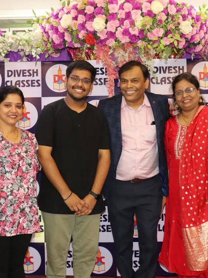 A proud moment for a student and his family, posing with Prof. Parab and a senior teacher at the farewell event.