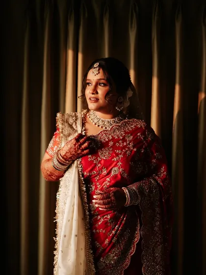 Another shot of the bride getting ready, capturing the serene moments before the ceremony.