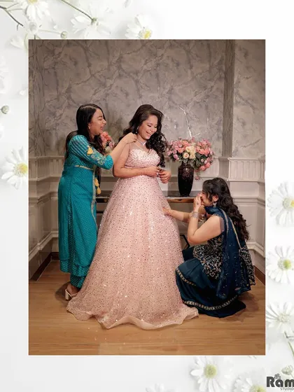A heartwarming, candid moment of the bride getting ready with the help of her friends or sisters. These behind-the-scenes shots are full of genuine emotion and support.