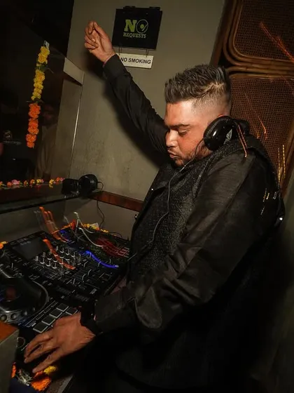 Raising the energy during a Diwali set. The gear is decorated with marigolds, blending tradition with modern beats.