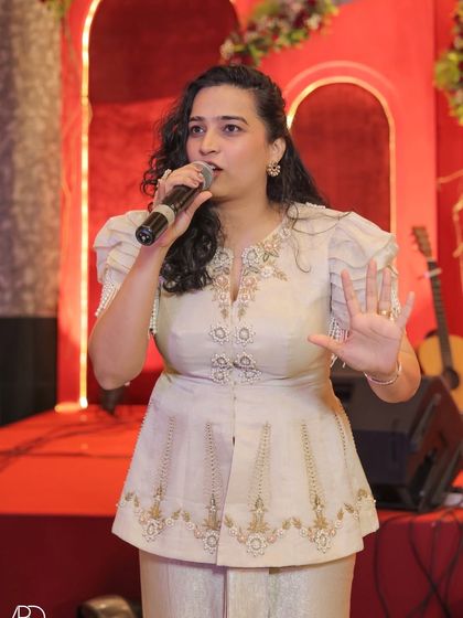 Actively hosting on stage during a housewarming party that had the feel of a wedding reception. My expressive style helps in captivating the audience and guiding the flow of the evening.