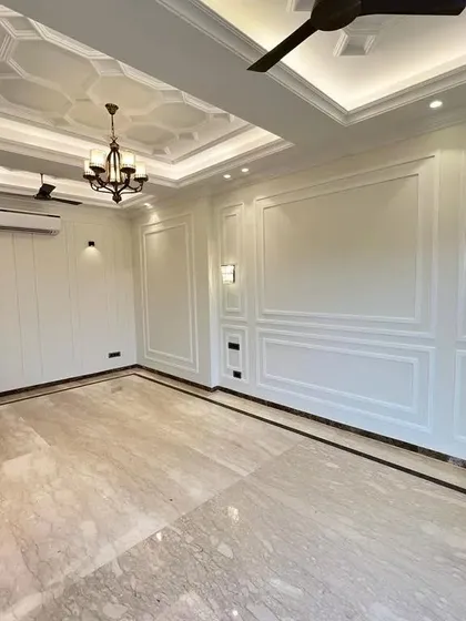 Look at the sheer scale and elegance here. The polished Italian marble floors reflect the light beautifully from the classical false ceilings. I design these spaces to be a perfect canvas for you to create your life's best memories.