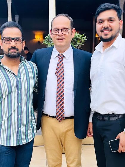 With fellow legal minds at a book launch. Continuous learning and celebrating the achievements of peers are vital for professional growth.