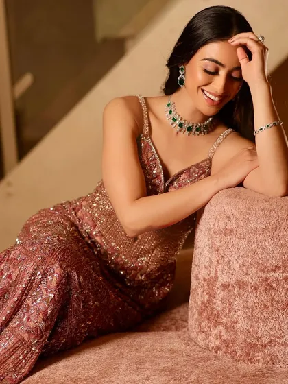 A candid moment from the shoot, showing how the makeup looks natural and radiant even in a relaxed pose. The happy glow is the best accessory.