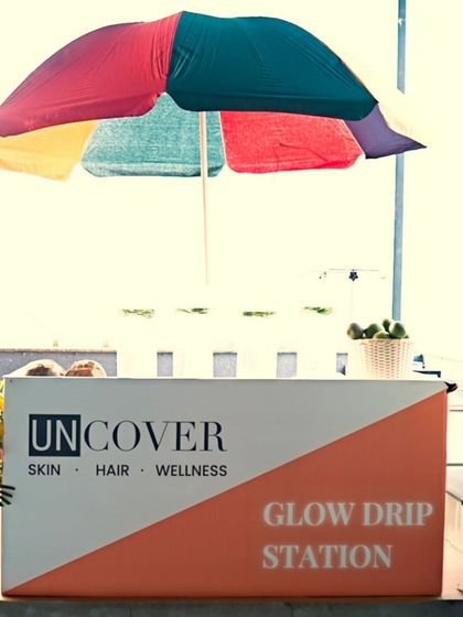 A fun, AI-edited shot of our Glow Drip station from our summer launch event. We love combining trends with timeless treatments.