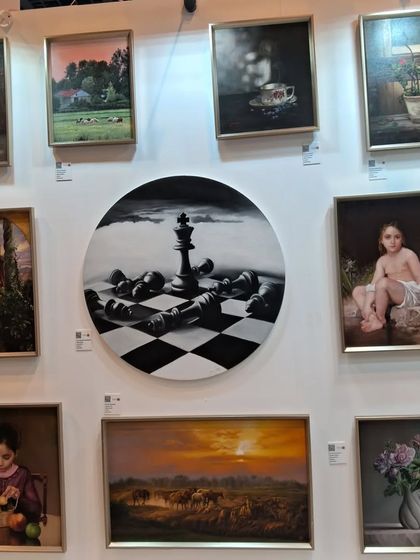 A gallery wall displaying the diverse range of realist and surrealist paintings by Zeinab Sarkhosh at World Art Dubai.