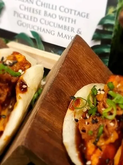 Our signature Korean cottage cheese baos with pickled cucumber and gochujang mayo. These soft, fluffy buns with a spicy, savory filling are always a crowd-pleaser.
