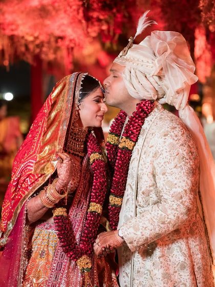 A sweet, romantic moment between Natasha and Pranshu. This photo highlights how their individual outfits come together to create a beautiful, cohesive story.