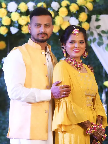 Another lovely portrait of the couple, with the groom's arm around his bride-to-be.