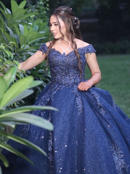 This image captures the dreamy quality of the engagement look. The soft makeup and flowing hair create a romantic vibe that is perfect for a pre-wedding celebration.