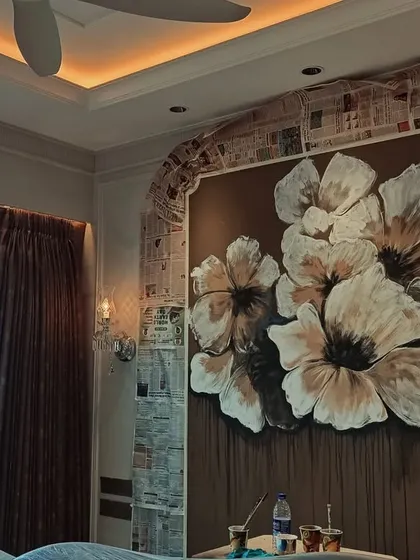 A behind-the-scenes look at the mural in progress. I always make sure to protect the surrounding area, carefully covering the walls and furniture before I begin painting.