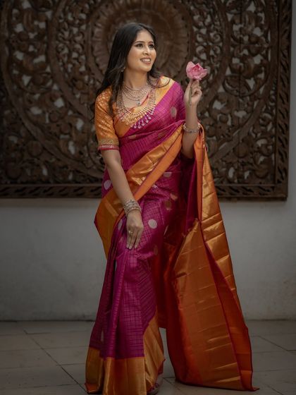 Another beautiful shot of the model with the lotus flower, a symbol of purity and beauty.