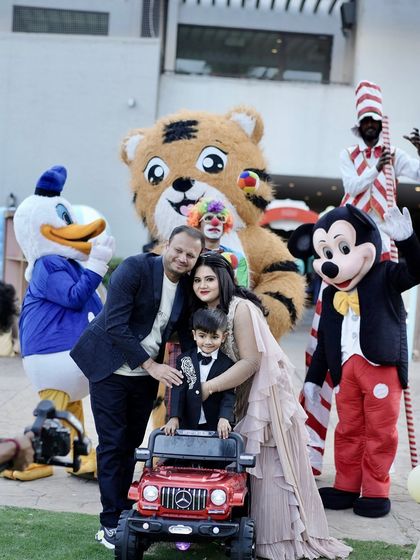 Another great shot of the birthday boy and his family posing with all the friendly character mascots.