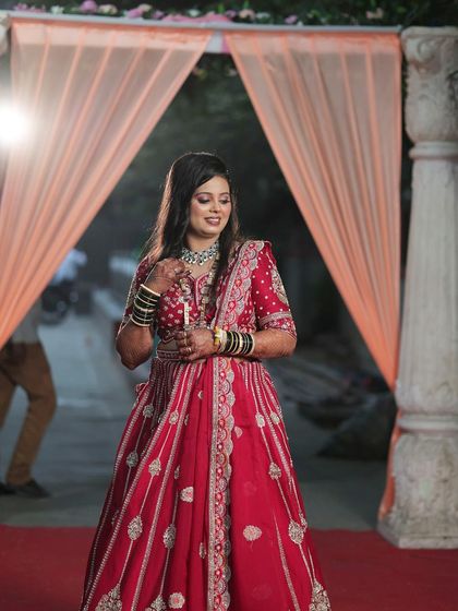 Here is one of my beautiful clients, ready for her big day in a classic red bridal lehenga. The detailed embroidery and traditional jewelry complete this timeless look.