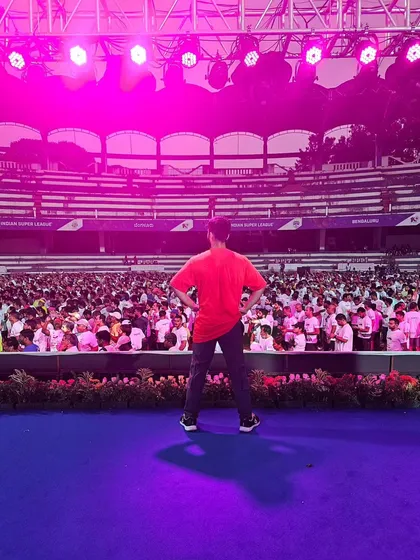 From the office floor to the stadium stage, we bring the same level of energy. Here I am, looking out at a massive crowd, ready to lead a high-energy Zumba warm-up. We handle events of all sizes with confidence and passion.