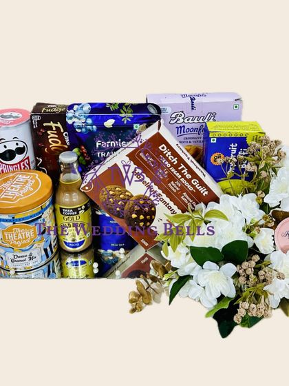 For the sibling who loves late-night munchies, this hamper is the perfect Rakhi gift. We've curated a selection of premium snacks and drinks on a sleek mirror tray.