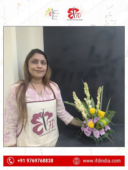 Confidence blooms from the very first class. Here, a new student showcases her initial design, learning essential techniques like balancing color and form with yellow roses and white tuberoses.